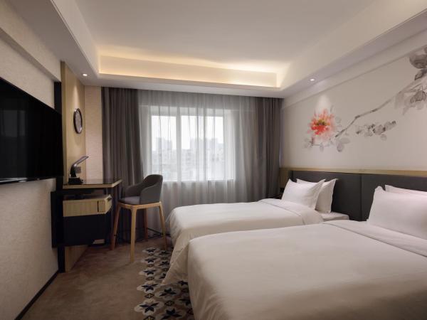 Paco Hotel Jiangtai Lu Metro Guangzhou ---Free Shuttle Bus For CantonFair : photo 2 de la chambre chambre lits jumeaux deluxe