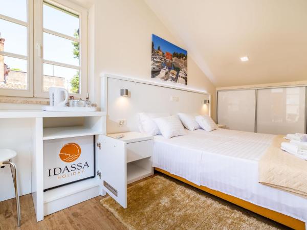 Idassa Atrium rooms : photo 1 de la chambre chambre double ou lits jumeaux avec terrasse