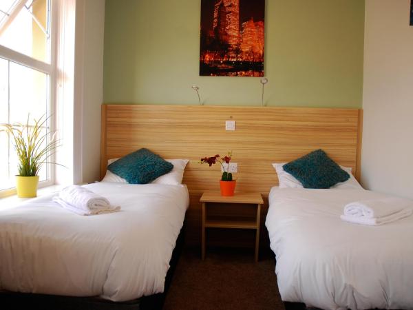 Botanic Rest Queens Quarter : photo 1 de la chambre chambre triple