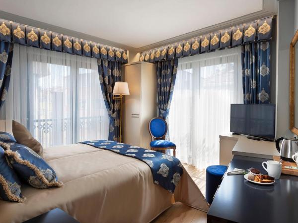 Güner Business Hotel : photo 2 de la chambre chambre double deluxe (2 adultes + 1 enfant)