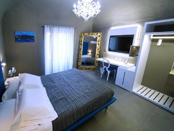 Etna Suite Group : photo 2 de la chambre suite lit king-size avec baignoire spa