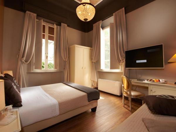 Villa Tower Inn : photo 6 de la chambre chambre triple familiale