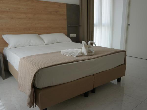 Hotel Ducale : photo 1 de la chambre chambre double ou lits jumeaux avec accès à la plage