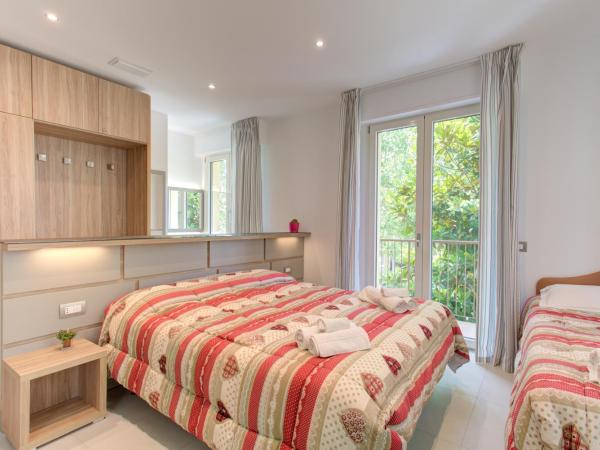 Alloggio Nella : photo 1 de la chambre chambre triple - vue sur jardin