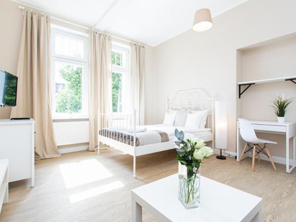 Riviera Rooms : photo 1 de la chambre chambre quadruple avec salle de bains commune