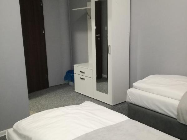 City Rooms Szczecin : photo 3 de la chambre chambre triple classique