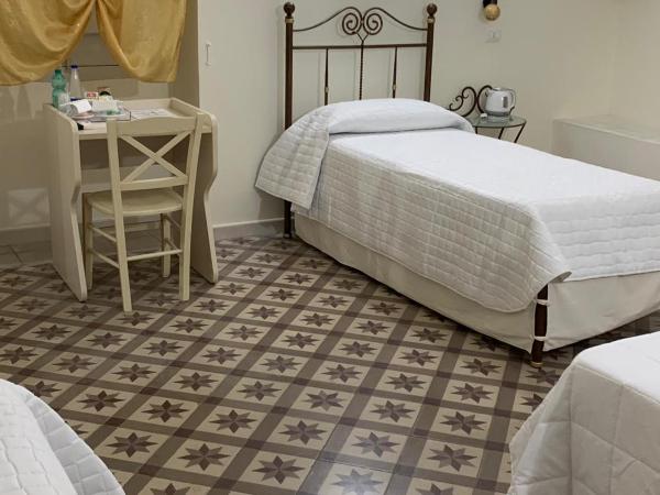 Pietre e Sassi : photo 2 de la chambre chambre quadruple avec salle de bains privative