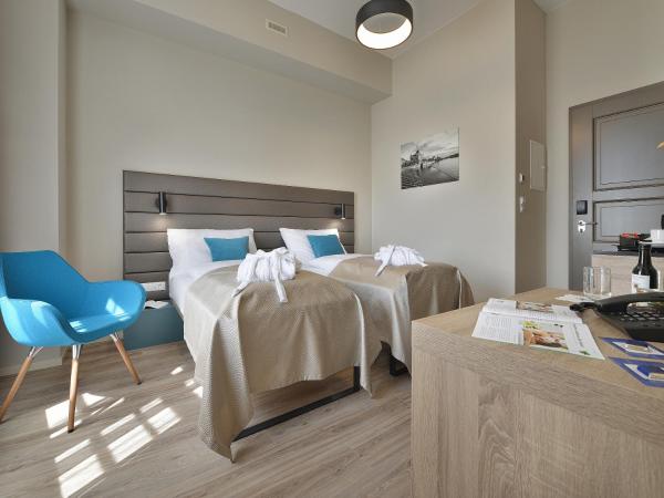 EA Hotel New Town : photo 3 de la chambre chambre lits jumeaux