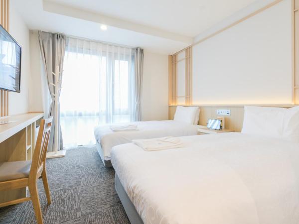 Henn na Hotel Kyoto Hachijoguchi : photo 7 de la chambre chambre lits jumeaux phiten
