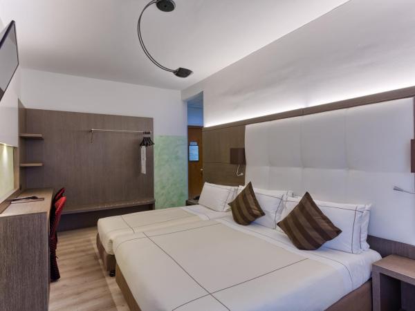 Agape Hotel AA Hotels : photo 2 de la chambre chambre triple