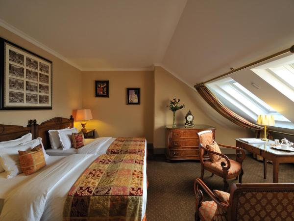 Hôtel de la Cigogne : photo 1 de la chambre suite en duplex avec lits jumeaux