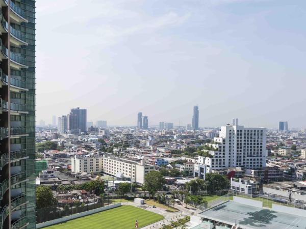 Hôtel Chatrium Riverside Bangkok : photo 10 de la chambre grande chambre lit king-size deluxe - vue sur ville 