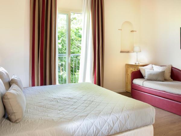 Hotel LaMorosa : photo 1 de la chambre chambre triple