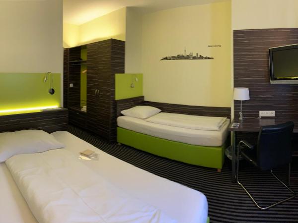 Behringers City Hotel Nürnberg : photo 4 de la chambre chambre triple standard avec petit lit double