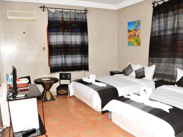 Riad Mhidou : photo 9 de la chambre chambre triple avec salle de bains privative