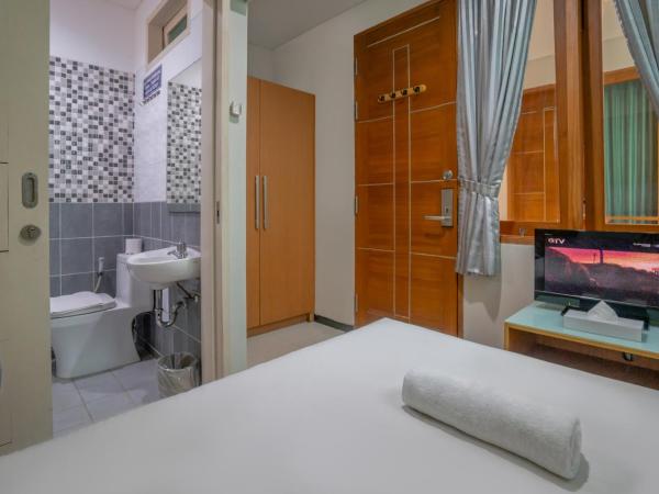 LeGreen Suite Tebet : photo 2 de la chambre chambre double standard