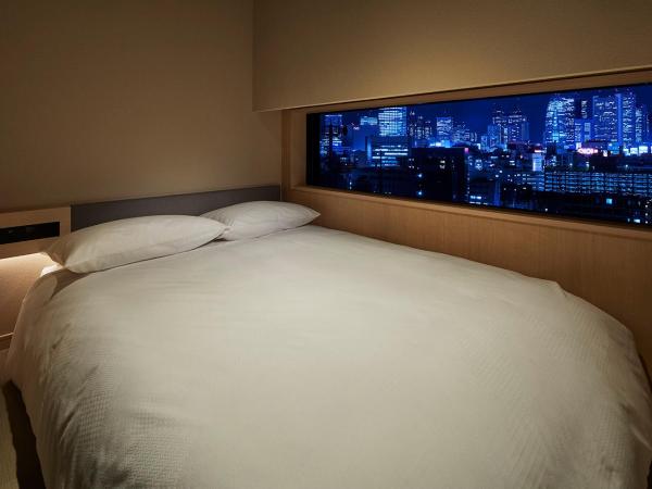 ONSEN RYOKAN YUEN SHINJUKU : photo 1 de la chambre chambre double avec petit lit double - non-fumeurs - vue sur ville