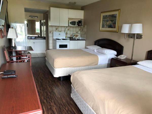 Travellers Inn : photo 1 de la chambre chambre avec 2 grands lits queen-size 