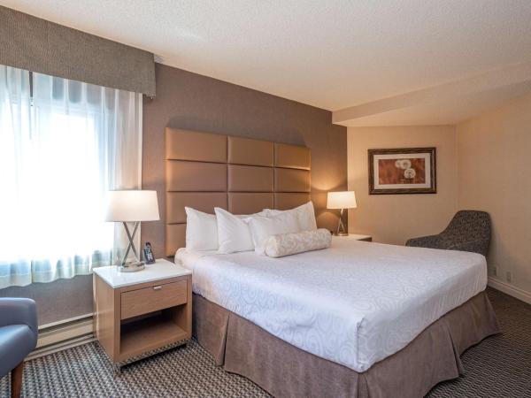 Best Western Premier Chateau Granville Hotel & Suites & Conference Centre : photo 1 de la chambre suite lit king-size avec balcon et canapé-lit - non-fumeurs