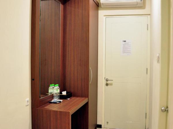 Grand Kebonsari Guesthouse : photo 6 de la chambre chambre lit king-size deluxe