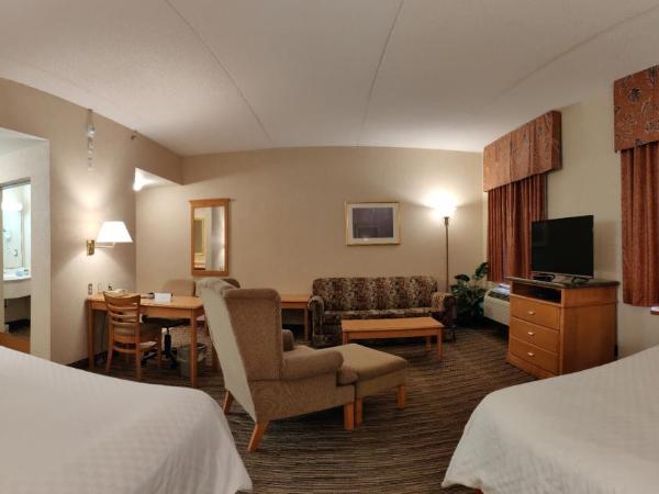 Humphry Inn and Suites : photo 4 de la chambre suite lit queen-size
