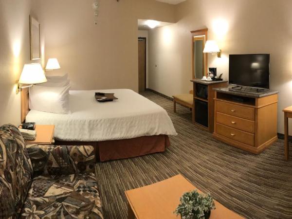 Humphry Inn and Suites : photo 7 de la chambre chambre lit king-size avec bureau