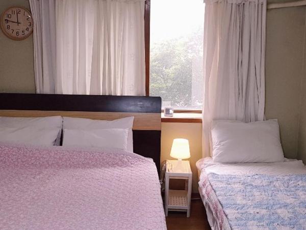 Appletree Guesthouse : photo 2 de la chambre chambre double ou lits jumeaux avec salle de bains commune