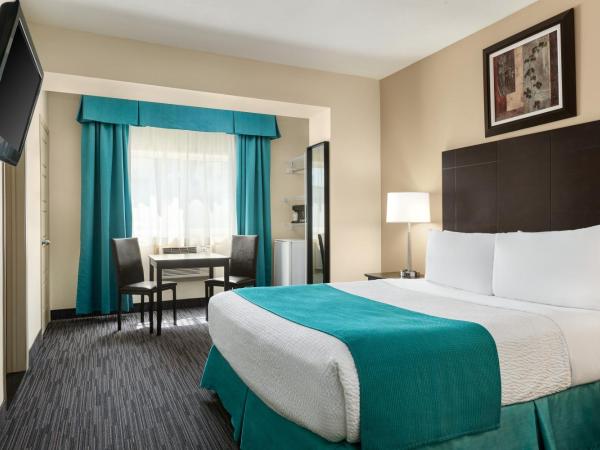 Days Inn by Wyndham Montreal East : photo 5 de la chambre chambre lit queen-size - non-fumeurs