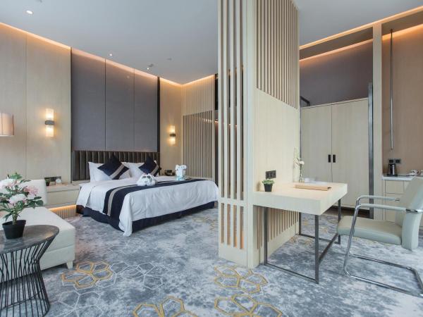 Chongqing Liyuan Hotel : photo 2 de la chambre chambre lit king-size exécutive