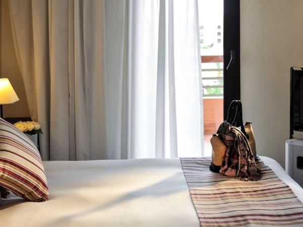 Novotel Marrakech Hivernage : photo 4 de la chambre chambre double supérieure avec canapé - vue sur ville