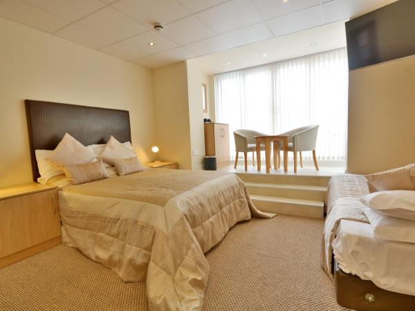 Stuart hotel : photo 1 de la chambre chambre triple avec balcon