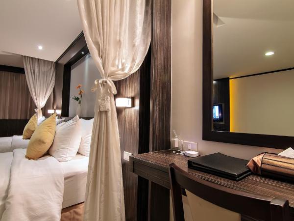 Bossotel Bangkok : photo 2 de la chambre chambre familiale avec 2 lits queen-size