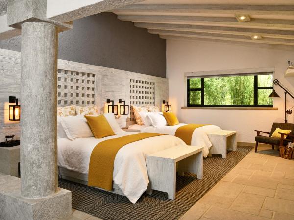 H21 Hospedaje Boutique : photo 1 de la chambre chambre double supérieure avec deux lits doubles