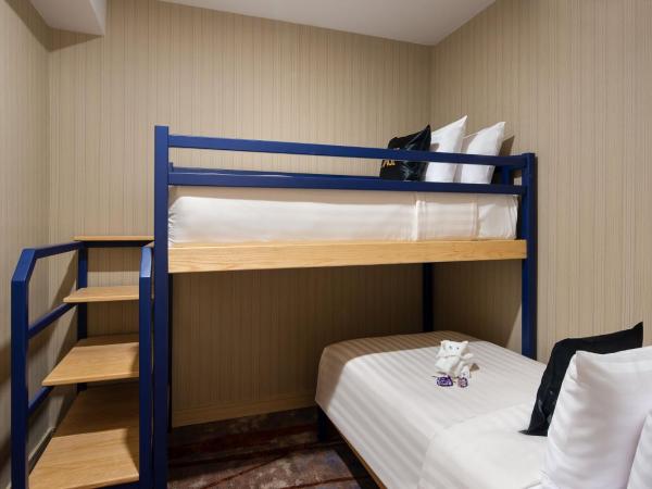 Eleven Hotel Bangkok Sukhumvit 11 : photo 3 de la chambre hébergement familial avec lits superposés