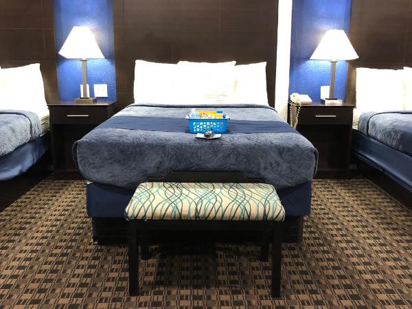 Budget Inn & Suites : photo 2 de la chambre chambre triple deluxe