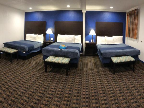 Budget Inn & Suites : photo 3 de la chambre chambre triple deluxe