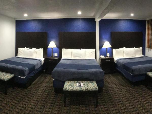 Budget Inn & Suites : photo 1 de la chambre chambre triple deluxe