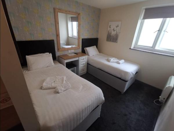 The Avenue Club and Lodge : photo 1 de la chambre chambre lits jumeaux standard