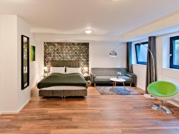 Eco Smart Apartments Nürnberg Süd : photo 1 de la chambre appartement suite confort au sous-sol avec canapé-lit