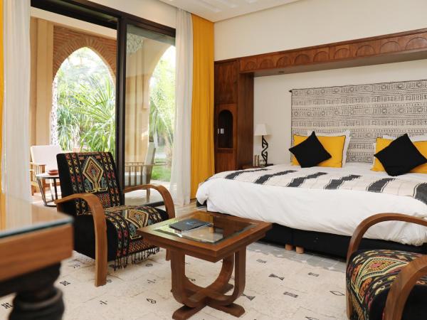 Villa Le Perroquet Bleu : photo 1 de la chambre suite lit queen-size deluxe