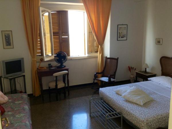 L'Oasi : photo 1 de la chambre chambre triple avec salle de bains privative séparée