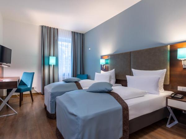 Trip Inn Hotel Messe Westend : photo 1 de la chambre chambre lits jumeaux