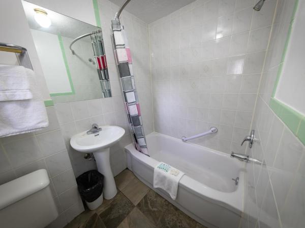 Villager Lodge Niagara Falls : photo 4 de la chambre suite deluxe avec lit king-size