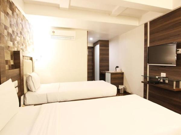 Hotel Aaram Orchard : photo 4 de la chambre chambre deluxe double ou lits jumeaux