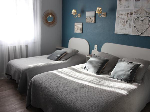 Hôtel le Chalet Fleuri : photo 1 de la chambre chambre triple