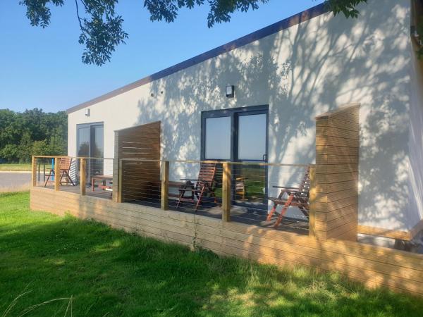 Open acres accommodation and airport parking : photo 10 de la chambre chambre lit king-size deluxe