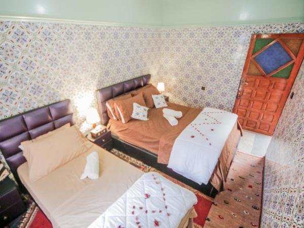 Dar Widad : photo 3 de la chambre chambre triple avec salle de bains commune