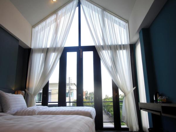 The Nichehome Waterside Living : photo 9 de la chambre chambre lits jumeaux standard avec vue sur jardin