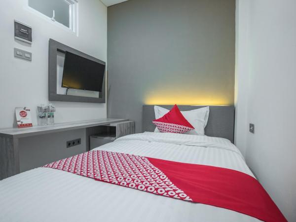 Super OYO 1487 Residence Khoe : photo 4 de la chambre chambre simple deluxe