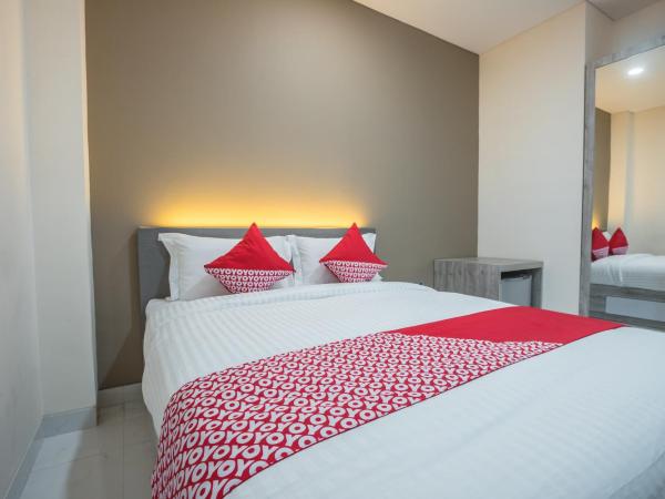 Super OYO 1487 Residence Khoe : photo 2 de la chambre chambre double deluxe